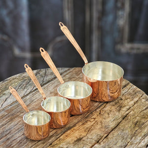 Rustic and timeless, these handcrafted vintage inspired Copper Measuring Cups will be your kitchen workhorse. Made from a very heavy gauge of solid copper, these measuring cups were inspired by an old Christofle cross and bow pattern from 1907, which is featured on each handle. Heirloom quality - made to be used, made to last, made to look good. Experience old European style in your own kitchen.