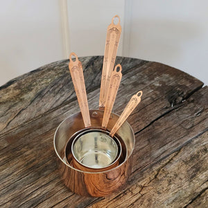 Rustic and timeless, these handcrafted vintage inspired Copper Measuring Cups will be your kitchen workhorse. Made from a very heavy gauge of solid copper, these measuring cups were inspired by an old Christofle cross and bow pattern from 1907, which is featured on each handle. Heirloom quality - made to be used, made to last, made to look good. Experience old European style in your own kitchen.