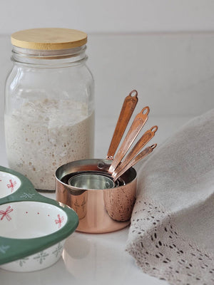 Wood Lid with Sourdough Starter and Copper Measuring Cups