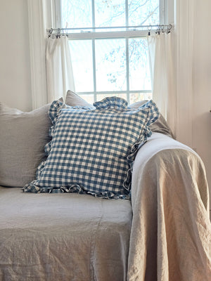 This Cottage Blue Gingham and Ruffles Pillow will bring classic English cottage style to any room. Featuring a classic country gingham pattern with sweet ruffled edges and an easy-to-remove zipper closure, it will add a touch of charm and sophistication. Spot clean only. 100% cotton cover with Polyester insert. 18" x 18"