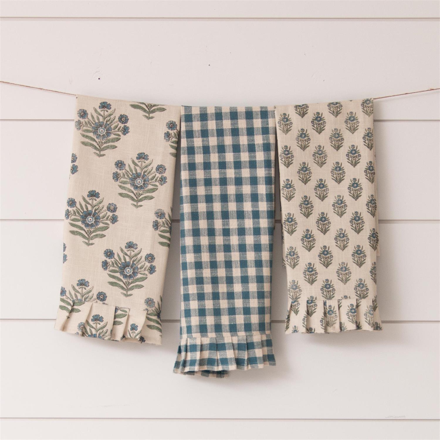 This beautiful set of three Cottage Blue Gingham and Block Print Tea Towels will give your kitchen a touch of English cottage charm. The mix of colors and patterns offers a relaxed country style with ruffled edges for added texture. Perfect for creating a cozy cottage feel in your home. 100% cotton. Machine wash. Set of Three. 17"W x 27"H
