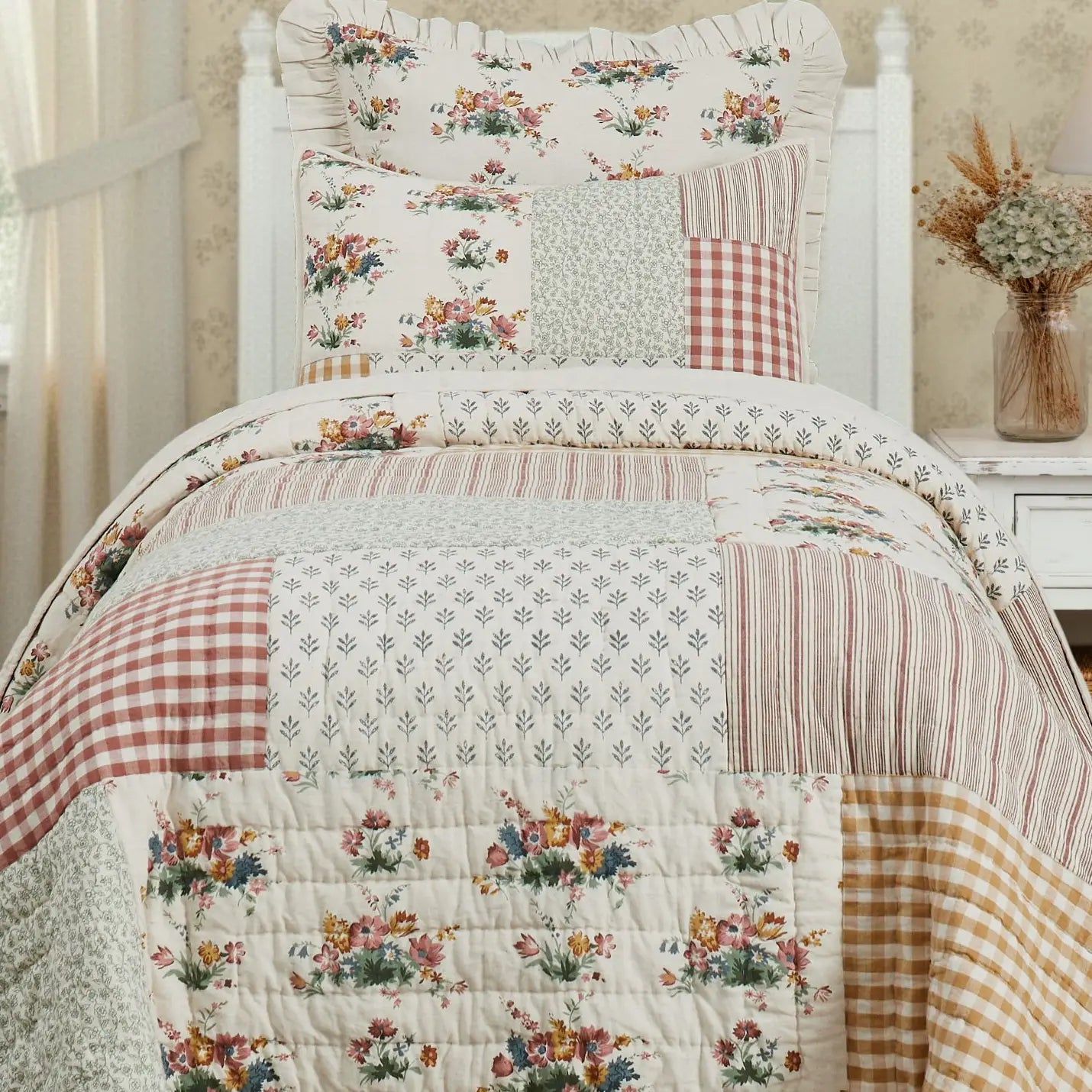 The Cottage Rose Patchwork Quilt Twin 3 Piece Set brings instant charm and character to any bedroom with a masterfully curated mix of botanical prints, classic gingham, and timeless stripes. It effortlessly brings a hand-collected, vintage-inspired look combined with a soft, intentional finish that pulls a room together without feeling over-styled. The back is a solid creamy oatmeal. The Twin Set includes one Euro Sham and one Standard Sham.