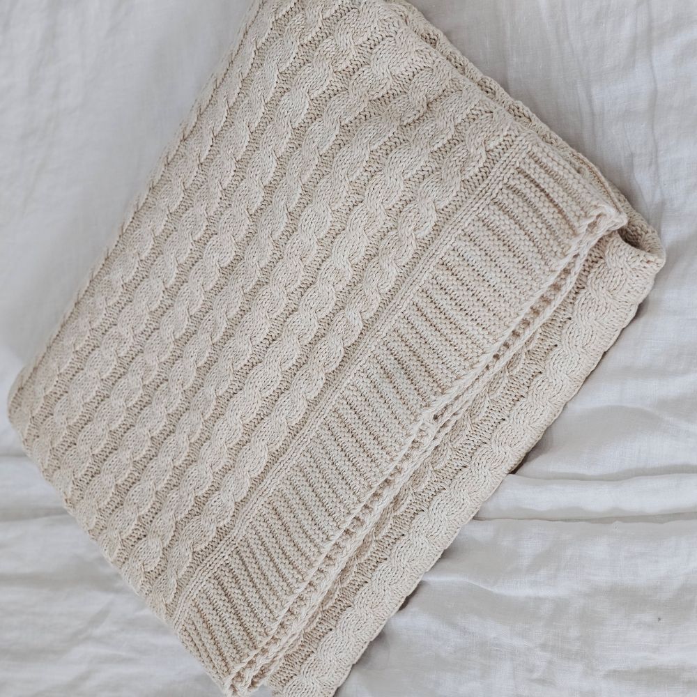 A nod to chunky knit sweaters, this cotton Cozy Cable Knit Throw offers heirloom quality and cozy comfort. The soft sand color and cotton knit suits any farmhouse style in any season. Perfect for getting comfy by the fire or curling up with a book or as a luxuriously soft cool option for summer. Hand wash recommended. Made of 100% Cotton. 50” x 60”