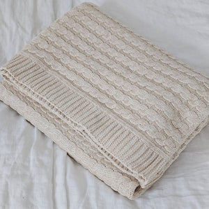 A nod to chunky knit sweaters, this cotton Cozy Cable Knit Throw offers heirloom quality and cozy comfort. The soft sand color and cotton knit suits any farmhouse style in any season. Perfect for getting comfy by the fire or curling up with a book or as a luxuriously soft cool option for summer. Hand wash recommended. Made of 100% Cotton. 50” x 60”