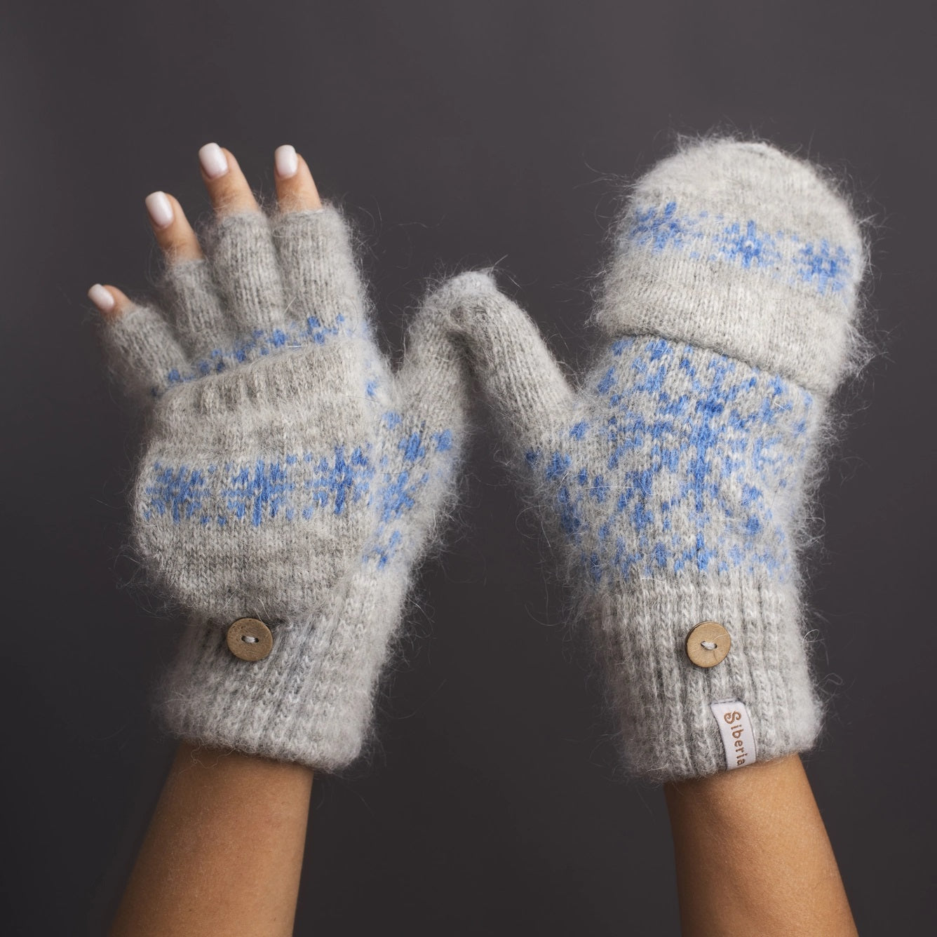 Our Cozy Snow Day Mittens offer luxurious warmth with a vintage vibe. Hand-knit with goat wool, which offer amazing proprieties such as moisture-wicking, order resistance, highly breathable, and ultra-warmth. They feature a soft blue woven snowflake design and a flap so fingertips can be exposed when needed.  Material: 80% soft goat hair, 19% acrylic fibers, 1% other fibers  Length: Wrist to tip of middle finger 10" Thickness: Heavy Weight  Care instructions: Machine wash gentle cycle cool water; air dry 
