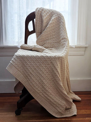 A nod to chunky knit sweaters, this cotton Cozy Cable Knit Throw offers heirloom quality and cozy comfort. The soft sand color and cotton knit suits any farmhouse style in any season. Perfect for getting comfy by the fire or curling up with a book or as a luxuriously soft cool option for summer. Hand wash recommended. Made of 100% Cotton. 50” x 60”