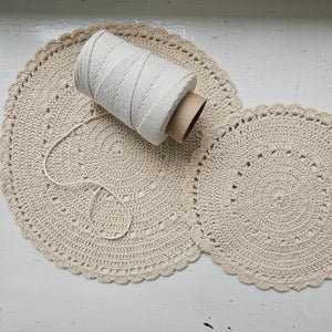 Let this charming Crochet Doily Set of Two add antique flair to your farmhouse. The warm oatmeal color and intricate lace design lends a soft touch to any room.  5"Diam, Set of two. Small is 8.25" Diam, Large is 11.50" Diam