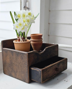 Add a touch of cheerful freshness to any space with our faux Potted Daffodils. Featuring three exposed bulbs bursting with creamy white narcissus flowers with a light yellow center, these sweet flowers are a perfect addition to any room. The faux terracotta pot has an aged, mossy finish for a touch of natural charm. 4" Diam x 11"H