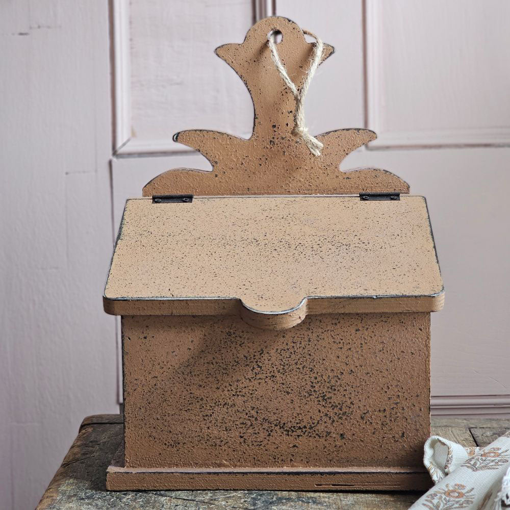 The Distressed Primitive Recipe Box brings a timeless, rustic charm to your kitchen decor. Adorned with a pineapple cutout and equipped with a pre-drilled hole and jute string, it offers flexible display options. Its colonial brown mustard finish, accented by subtle dark wood undertones, creates an authentic antique appeal. This elegant wooden box is perfect for organizing recipe cards (not included) or small keepsakes. 