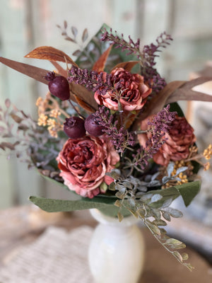 The Duchess Bouquet looks like it just came from the florist! Blooms in gorgeous shades are enhanced with the addition of berries, sprigs of tiny bubble berries and seed heads, colorful leaves, and sprigs of trailing greenery. The Duchess Bouquet is infused with the warmth of the season. The lushly layered colors and textures in this faux floral bouquet add an elegant touch to any room. This showy bouquet, in gorgeous tonal colors, makes a grand statement in displays.Each bouquet is wrapped