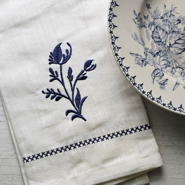 https://farmhousewares.com/cdn/shop/files/Embroidered-Dish-Towel-with-Delft-Blue-Sprig-SQ_600x.jpg?v=1697727929