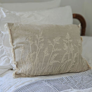 Add relaxed, down-to-earth style with our Embroidered Meadow Grasses Pillow. Made with 100% cotton, this accent pillow features a flax linen look, with a warm oatmeal color and rustic texture. The embroidered meadow grass design and fringe sides lend added texture and style. Pillow features a zipper to easily remove and clean cover. Includes polyester insert. 20"L x 14"H