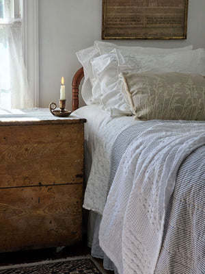Add relaxed, down-to-earth style with our Embroidered Meadow Grasses Pillow. Made with 100% cotton, this accent pillow features a flax linen look, with a warm oatmeal color and rustic texture. The embroidered meadow grass design and fringe sides lend added texture and style. Pillow features a zipper to easily remove and clean cover. Includes polyester insert. 20"L x 14"H