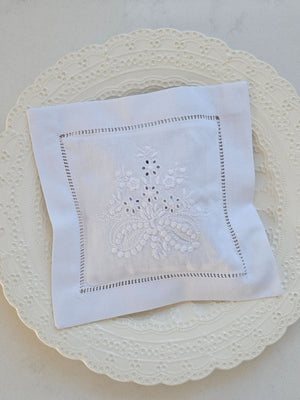Keep laundry and linens smelling fresh with our Embroidered Lavender Sachet. This crisp white cotton sachet case is embroidered in Portugal with a French floral design and has hemstitched detail around the edges. The inner sachet pillow is filled with lavender from Provence, France . The lavender scent will last for years with just a squeeze or two from time to time. It features a pocket in the back so the lavender bag can be easily removed/replaced and the case can be washed if needed.
