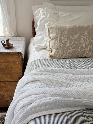 Add relaxed, down-to-earth style with our Embroidered Meadow Grasses Pillow. Made with 100% cotton, this accent pillow features a flax linen look, with a warm oatmeal color and rustic texture. The embroidered meadow grass design and fringe sides lend added texture and style. Pillow features a zipper to easily remove and clean cover. Includes polyester insert. 20"L x 14"H