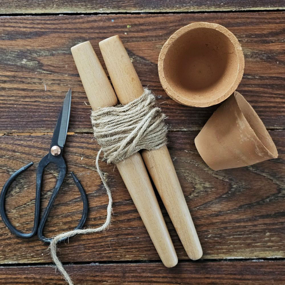 The English Style Garden Row Marker is an essential tool to keep in the potting shed and put to use when it comes time to create perfect planting lines.

The wooden stakes and twine row marker keeps seeds and plants in your vegetable patch or herb bed in line and organized.