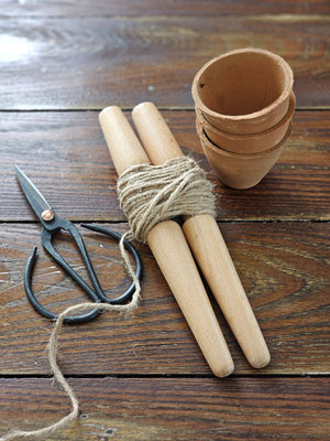 The English Style Garden Row Marker is an essential tool to keep in the potting shed and put to use when it comes time to create perfect planting lines.

The wooden stakes and twine row marker keeps seeds and plants in your vegetable patch or herb bed in line and organized.