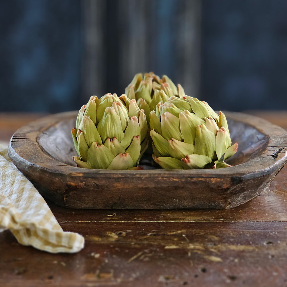 Add a rustic, earthy touch with these handcrafted fabric artichoke heads. Each of the three has a bit of aging on the edges for a realistic look, making them perfect for decorating bowls or pots. An ideal way to add charm to your home decor! Set of three. 3.5" x 4"H