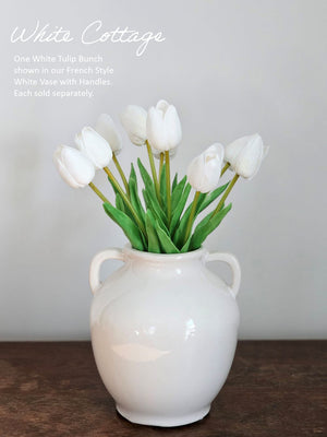 White tulips in a white vase 