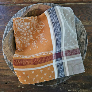 The French Country Woven Jacquard Napkin brings authentic Provence charm to your table. Handwoven in France, this 20" x 20" napkin features a timeless grape motif in warm caramel, burgundy, navy, and beige tones. Each piece combines classic design with rustic elegance, perfect for everyday dining or special gatherings. A curated accent for farmhouse and traditional decor. Each sold separately. 20 x 20"