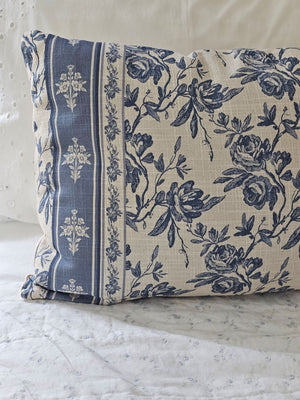 Add French country cottage charm to any room with this French Blue Floral Pillow. Features a creamy oatmeal fabric with French blue/gray floral design. Crafted from 100% cotton. Includes a zippered closure for easy removal. Polyester insert included. 22"L x 14"