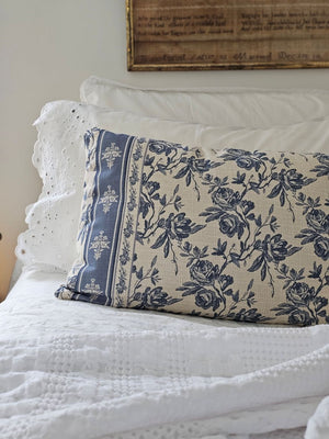 Add French country cottage charm to any room with this French Blue Floral Pillow. Features a creamy oatmeal fabric with French blue/gray floral design. Crafted from 100% cotton. Includes a zippered closure for easy removal. Polyester insert included. 22"L x 14"