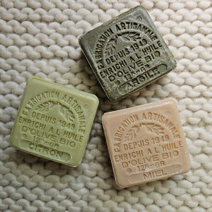 These authentic 100% natural and organic french soaps are made with pure olive oil. The delicate scents fill the air with fresh, clean aromas as you soothe and soften skin with nurturing olive oil. Each soap is stamped for added beauty. Fill a jar and create a beautiful accent for your bath. Set of three. The set includes one lemon or lavender, one honey and one clay soap. Each 4.41oz