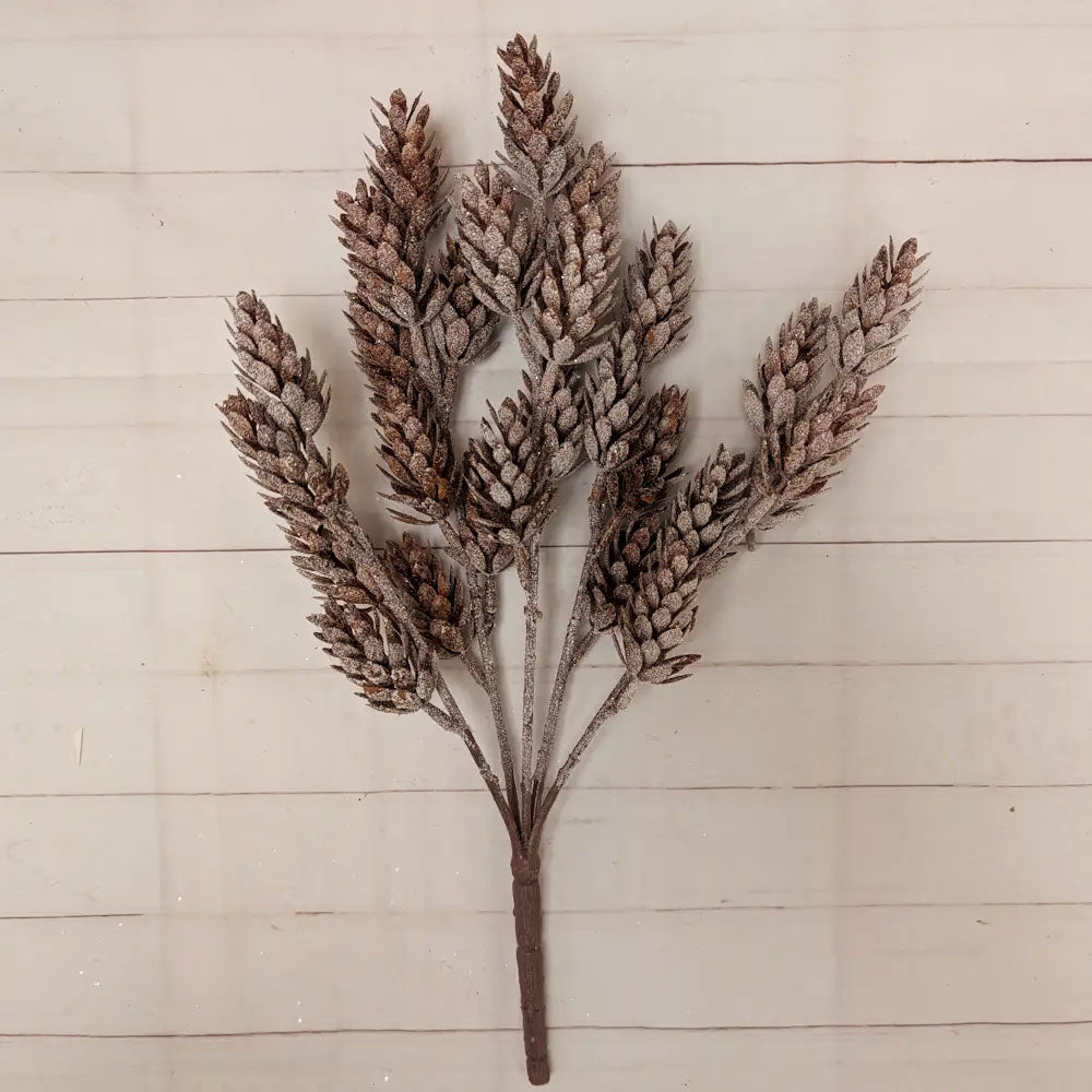 The Frosty Pine Cone Bush adds a rustic, down-to-earth charm to any room. This beautiful pine cone bush is weatherproof and has a great snowy sparkle finish. It measures 14" tall and is one wire for easy shaping. It can be easily cut apart for crafting / wreath making. Endless options for a magical woodland appearance.