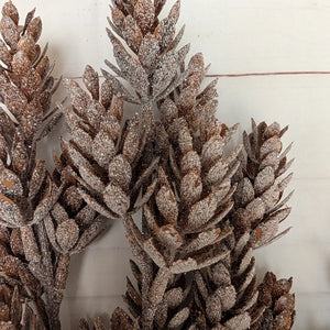The Frosty Pine Cone Bush adds a rustic, down-to-earth charm to any room. This beautiful pine cone bush is weatherproof and has a great snowy sparkle finish. It measures 14" tall and is one wire for easy shaping. It can be easily cut apart for crafting / wreath making. Endless options for a magical woodland appearance. 14"H
