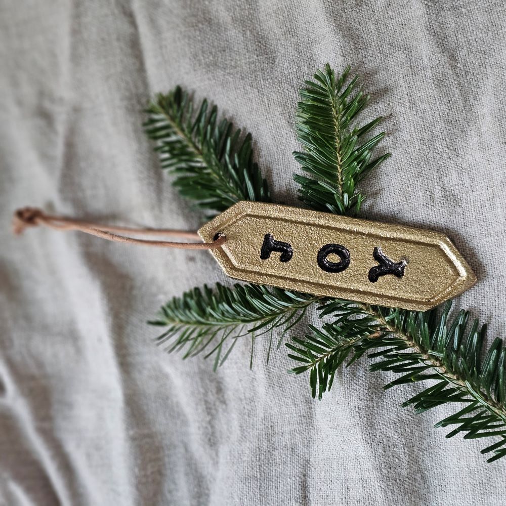 Enhance your holiday decor with our Gold Joy Tag Ornament Set. Each ornament features a durable leather loop for easy hanging and can be used to add a special touch to your gifts or adorn your tree. Celebrate the season with this elegant and versatile tag. Set of three.