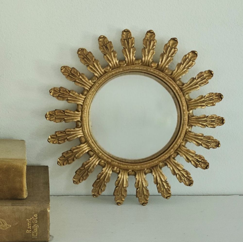 This vintage style Gold Leaf Convex Wall Mirror lends instant ambiance to any room. This round convex mirror has an aged gold finish with a leaf motif for a luxurious look. The ornate design will add a touch of sophistication and antique style charm to your home. The convex mirror has a curved reflective surface that bulges outward toward the light source. Includes a sawtooth hanger on back for hanging. Polyresin. 7.6" Diam