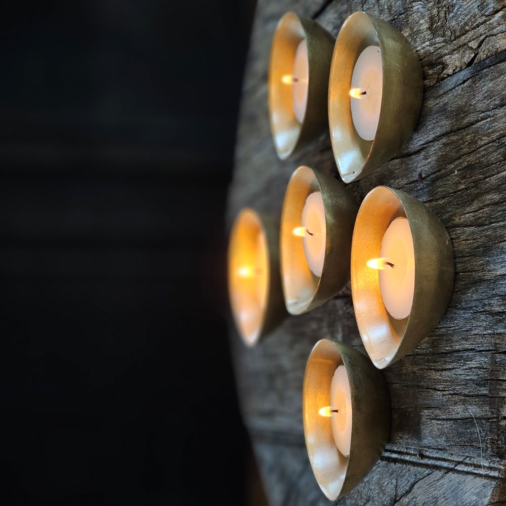A simple and elegant way to add shimmering candlelight to any room. The antiqued brass of these Gold Tea Light Candle Bowls perfectly catches the glow of each flame. Tealight Candle not included. Set of six. Each is 2.50"W x 1"H