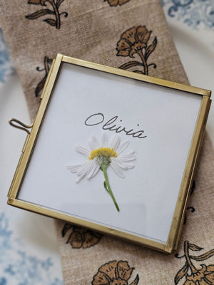 Elevate your event with our Gold and Glass Easel Picture Frame Place Card Holder Set. Featuring a refined vintage-inspired design accented in gold, these floating picture frames offer a unique way to create place card settings or table numbers that will delight guests and spark conversation. &nbsp;Perfect for weddings, parties, or any gathering, their elegant gold finish and clear glass let your creativity shine—endless possibilities await to make your event memorable! includes three empty 3 x 3 frames 