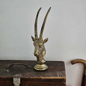 Graceful in the wild and on your table, the gazelle is a luxurious touch to a room. The Golden Gazelle Statue features an elegant, antique gold finish and can be placed among books and trinkets on a tabletop. Item is fashioned of resin. 3¼''W x 3½''D x 11''H
