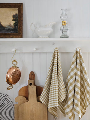 Add rustic farmhouse style to your kitchen with our Golden Wheat Gingham Kitchen Towel Set. Made of 100% cotton, the classic check pattern in a warm golden tan and cream is perfect for adding a charming cottage twist to your home. They're easy to care for, making them perfect for every day use. English Kitchen Style