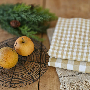 Add rustic farmhouse style to your kitchen with our Golden Wheat Gingham Kitchen Towel Set. Made of 100% cotton, the classic check pattern in a warm golden tan and cream is perfect for adding a charming cottage twist to your home. They're easy to care for, making them perfect for every day use.