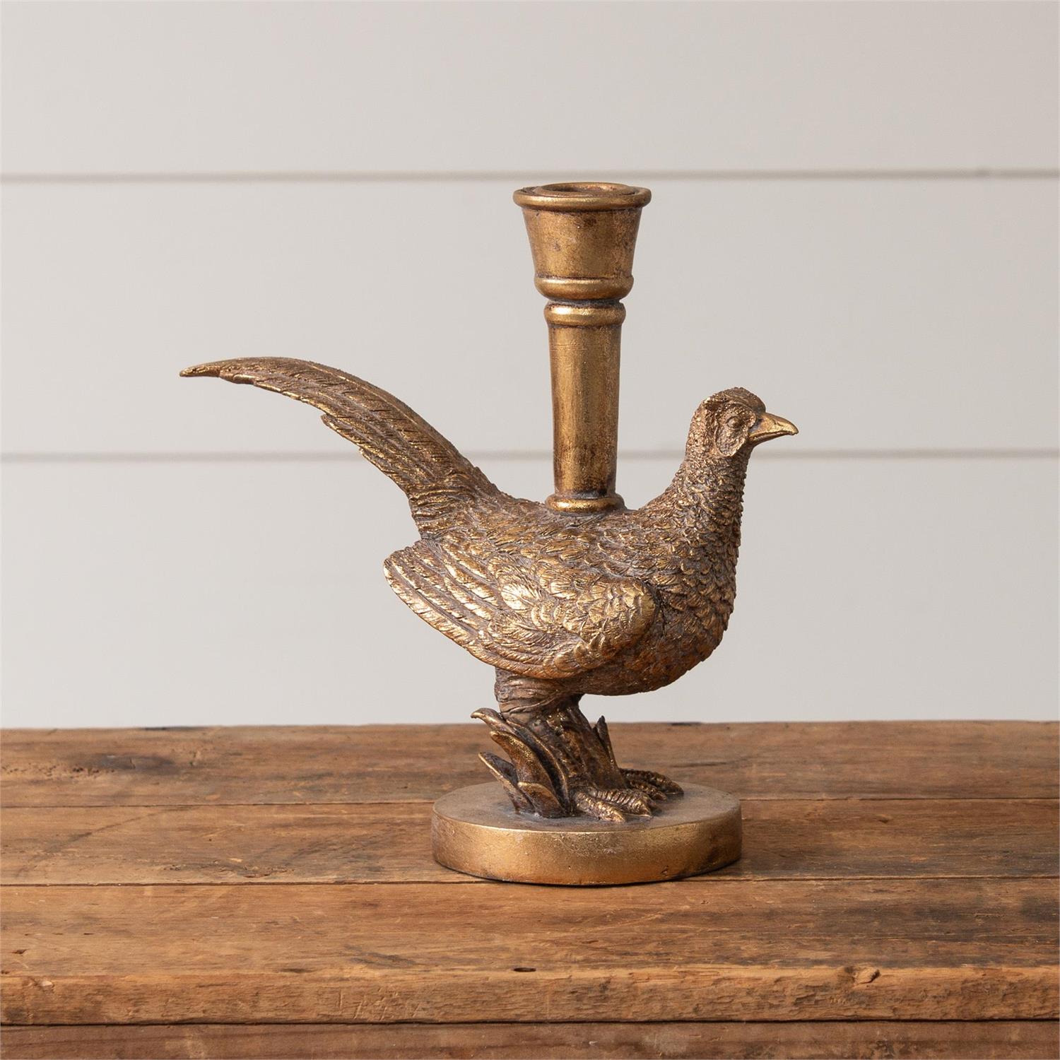 This Golden Aged Golden Aged Pheasant Candle Holder features a distressed gold patina that makes it feel like an old-world heirloom. The pheasant feather detail adds quality and elegance to this candle holder. Holds a regular size taper candle. It is made of stonepowder and resin with a highly distressed finish. Candle not included.