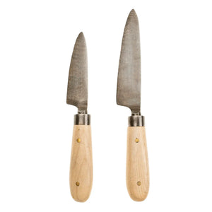 Upgrade your culinary tools with these Hand-Forged Cheese Knives. Featuring a combination of beechwood handles and stainless steel blades, these hand-forged knives offer precision and durability for everyday use. Beautifully packaged, they make a thoughtful hostess gift or a stylish addition to your flatware collection. Designed with sustainable materials and traditional crafting methods, these knives blend practicality with artisanal charm.