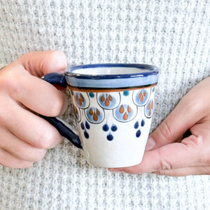 Every sip from our Porto Hand-Painted Espresso Cup is a reminder to slow down and appreciate the simple things in life. This ceramic mug will make you dream of far-away places with its vibrant blue and brown teardrop design.&nbsp;

Made from the finest volcanic clay, the cup combines traditional pottery techniques with modern high-firing processes, ensuring a lead-free, durable, and microwave-safe finish. Its compact size and sturdy design make it a delightful addition to your kitchen or coffee bar.