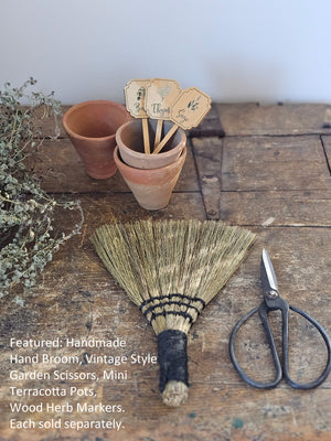Whether you're cleaning up bread crumbs or keeping the potting shed tidy, this Handmade Hand Broom is a must-have around the farmhouse. These hand-made brooms crafted by Indonesian artisans in small batches and are perfect for displaying on a hook for an old-fashioned look.  Every product is made from natural material. Variations in pattern, color and appearance can be expected. 7.75"H