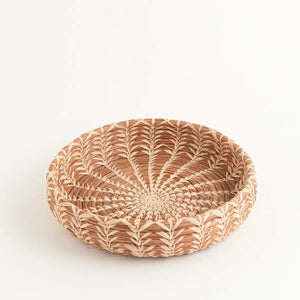 The Handwoven Cloud Forest Basket Bowl adds genuine elegance and warmth to any setting. Perfect for holding pastries at breakfast or organizing keys and essentials near your door, each basket is a testament to craftsmanship. Created of sustainable pine needles by women using time-honored techniques, these fair trade pieces support economic development and education for the women in La Fe through a dedicated nonprofit partnership.