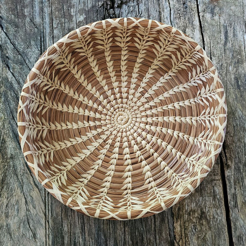 The Handwoven Cloud Forest Basket Bowl adds genuine elegance and warmth to any setting. Perfect for holding pastries at breakfast or organizing keys and essentials on an entryway table, each basket is a testament to craftsmanship. Created of sustainable pine needles by women using time-honored techniques, these fair trade pieces support economic development and education for the women in La Fe through a dedicated nonprofit partnership.