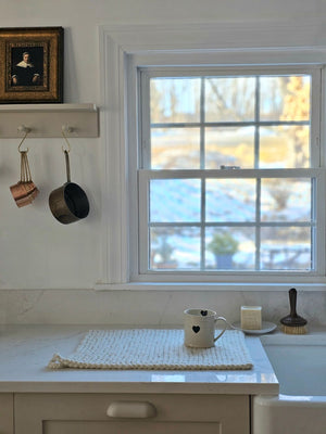 Every sip from our Rustic Heart Mug is a reminder to slow down and appreciate the simple things in life. This stoneware mug is the perfect shape to hold, and the hand-painted hearts spread a little love. Features a rustic light beige glaze with a raised black heart on the outer portion of the mug and a painted black heart on the inside as well.