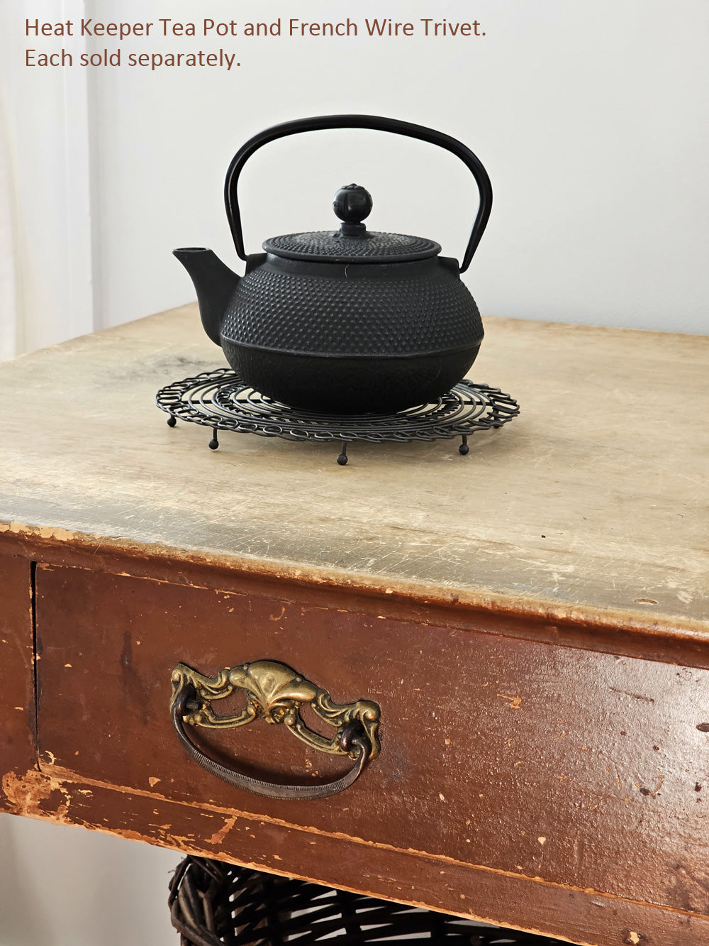 https://farmhousewares.com/cdn/shop/files/Heat-Keeper-Tea-Pot-with-Trivet-Desk-V-TXT_2048x.jpg?v=1702249982