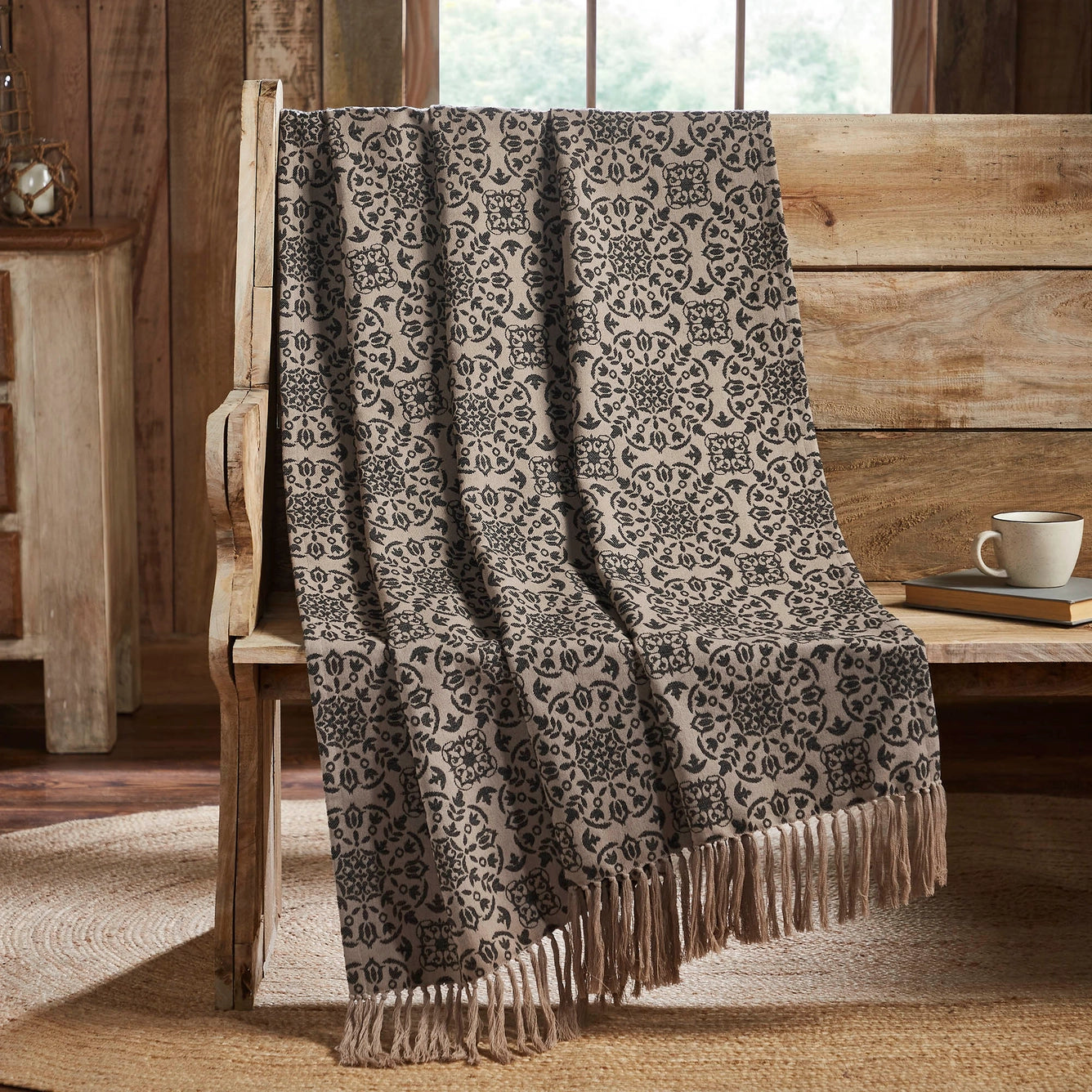 The Heritage Black and Tan Reversible Throw Blanket brings a timeless ambiance to any room. Adorned with a woven medallion design, this decorative throw blanket effortlessly adds warmth and character to your space with its old-world cottage charm. This double-sided throw seamlessly blends with any neutral color scheme and mixes and matches easily for a layered English cottage feel.