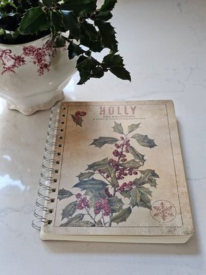 Capture the essence of winter botanicals with our Holly Notebook from our Christmas collection. This double-sided design features vintage plant study artwork rendered in distressed details that evoke timeless charm and aged character. With 120 lined pages, it's an ideal companion for journaling, note-taking, or sketching throughout the season. A thoughtfully curated gift for those who appreciate seasonal aesthetics and botanical inspiration.