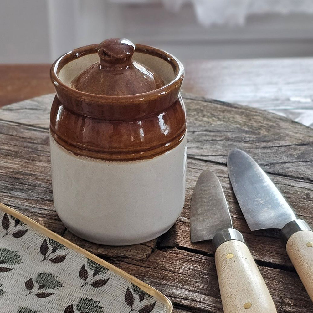 This handmade ceramic Indian Pickle and Jam Jar is more than just a functional container—it is a celebration of craftsmanship, tradition, and cultural heritage. Once used throughout India to store and preserve pickles, spices, and foods, these jars were cherished for their food-safe design and durability.