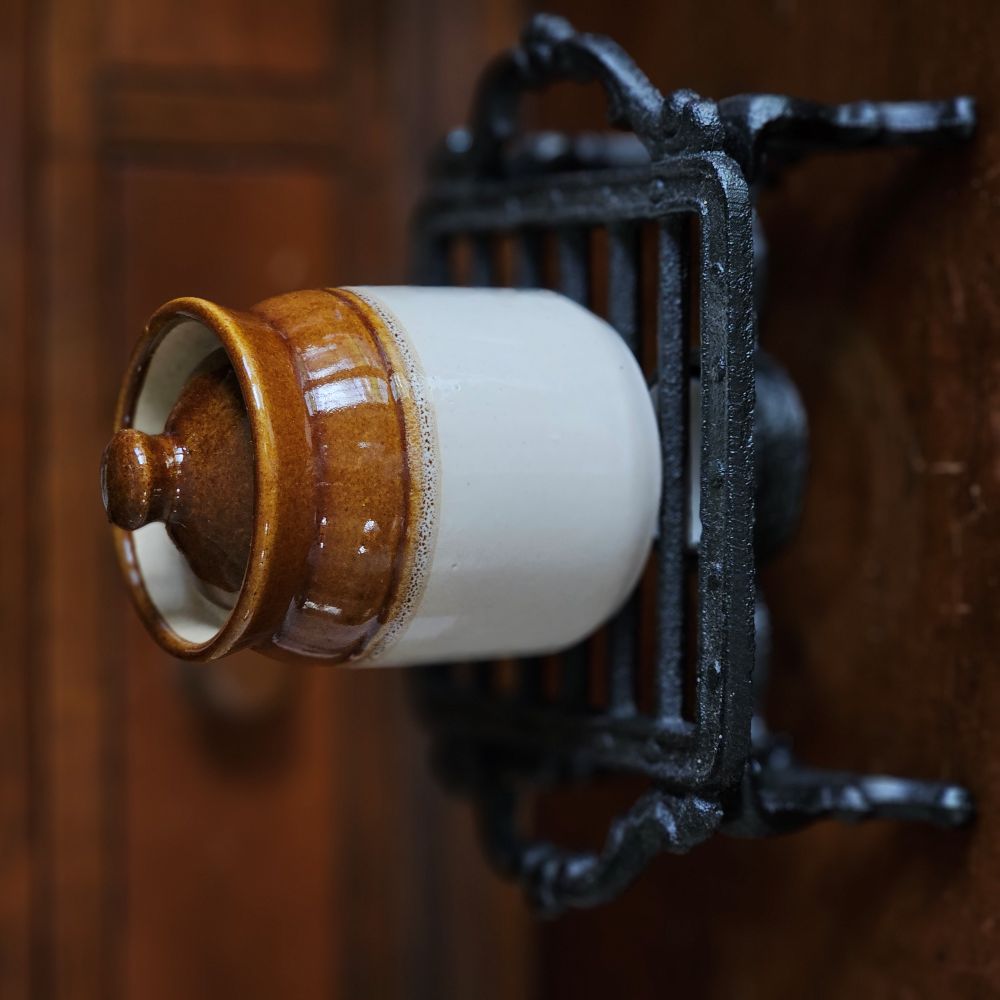 This handmade ceramic Indian Pickle and Jam Jar is more than just a functional container—it is a celebration of craftsmanship, tradition, and cultural heritage. Once used throughout India to store and preserve pickles, spices, and foods, these jars were cherished for their food-safe design and durability.

Each jar is crafted by skilled artisans, showcasing simple yet timeless shapes that carry the story of a bygone era. 