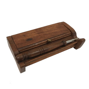 The Inkwell Stand with Porcelain Inkwells and Wood Nib Pen Set makes a perfect desk accessory reminiscent of early Colonial days. The set features a wood inkwell stand that opens and closes, two white porcelain inkwells, a wood nib writing pen, and a bag black ink powder so you can easily get started.