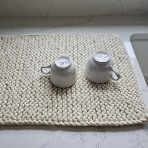 This Knitted Wool Dish Drying Mat is an all-natural alternative for your kitchen. It catches water drips as your dishes dry and keeps your dishes cushioned from your counter. Naturally antimicrobial, wool is capable of easily absorbing moisture and then evaporating it over time. Hand-knit and naturally dyed, these dish mats add a beautiful texture to your sustainable kitchen.